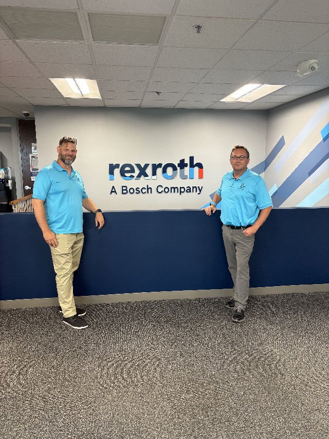 Two people at a Bosch Rexroth reception area